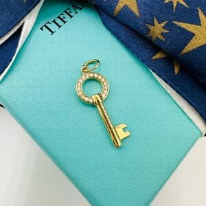 Tiffany & Co. .04 CTW Diamond Modern Open Round Key Charm in 18K Yellow Gold
